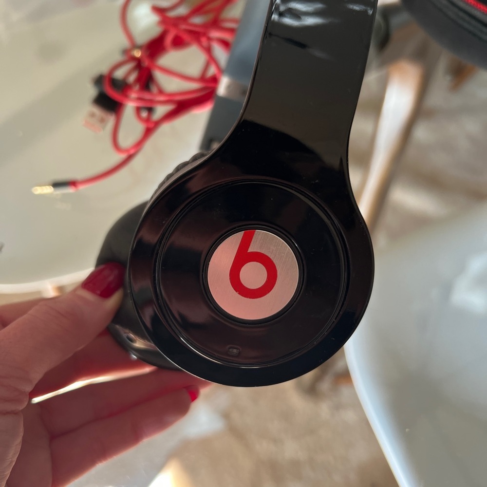 Beats by Dre over ear headphones.